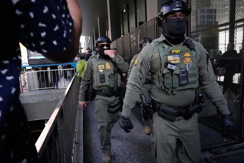 U.S. Customs and Border Patrol agents arrive to escort U.S. Customs and Border Patrol Gregory Bovino from federal court in Chicago, Tuesday, Oct. 28, 2025. (AP Photo/Nam Y. Huh)