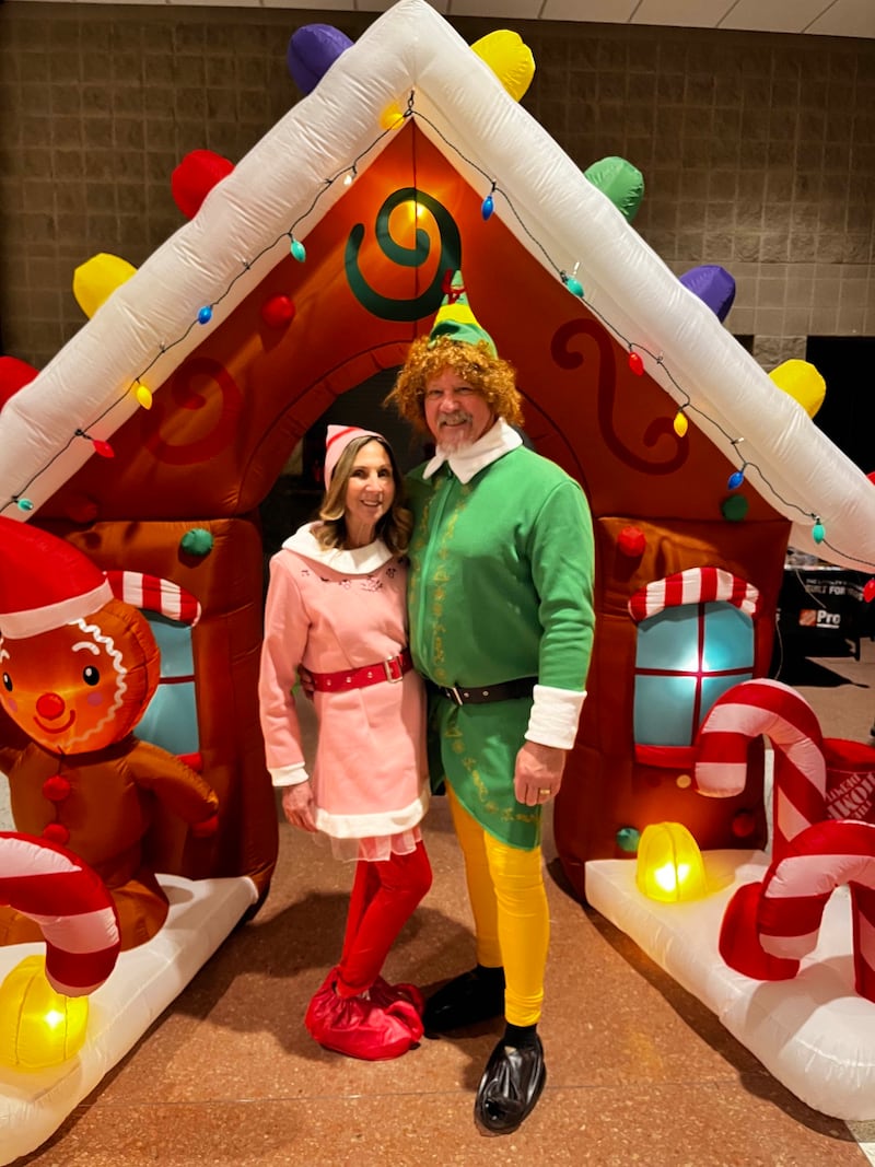 Donna and Mark Adams of Paradise Financial Partners pair up for some elvish fun at the inaugural Mistletoe & Martinis — A Festive Christmas Market. The second annual event is set for Black Friday at Countryside Banquets, Lakemoor.
