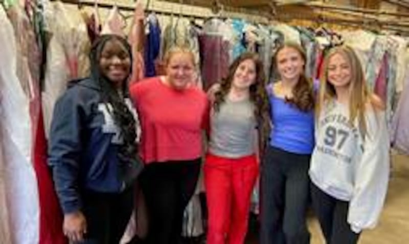 Pictured are student volunteers who helped with preparation for the 2025 Pop Up Prom Experience (left to right): Janelle Tezzo, Suzy Trznade and Rachel Feinendegen, Carmel Catholic High School; and, Morgan Ghys and Taylor Pugh, Warren Township High School.