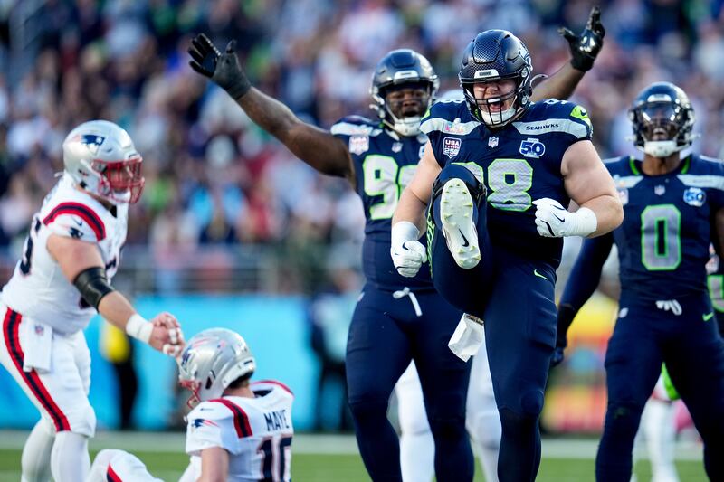 Seattle Seahawks defensive end Rylie Mills (98) celebrates after sacking New England Patriots quarterback Drake Maye during the first half of the NFL Super Bowl 60 football game, Sunday, Feb. 8, 2026, in Santa Clara, Calif. (AP Photo/Sue Ogrocki)