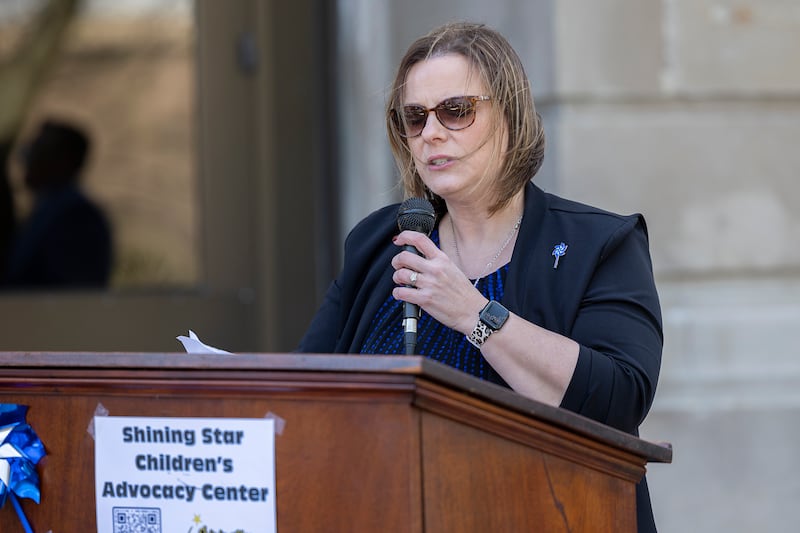 Shining Star Executive Director Jessica Cash opens the Hands Around the Courthouse ceremony Friday, April 19, 2024 at the Old Lee County Courthouse in Dixon. A crowd gathered on the lawn to bring awareness to child abuse prevention. April is National Child Abuse Prevention Month.