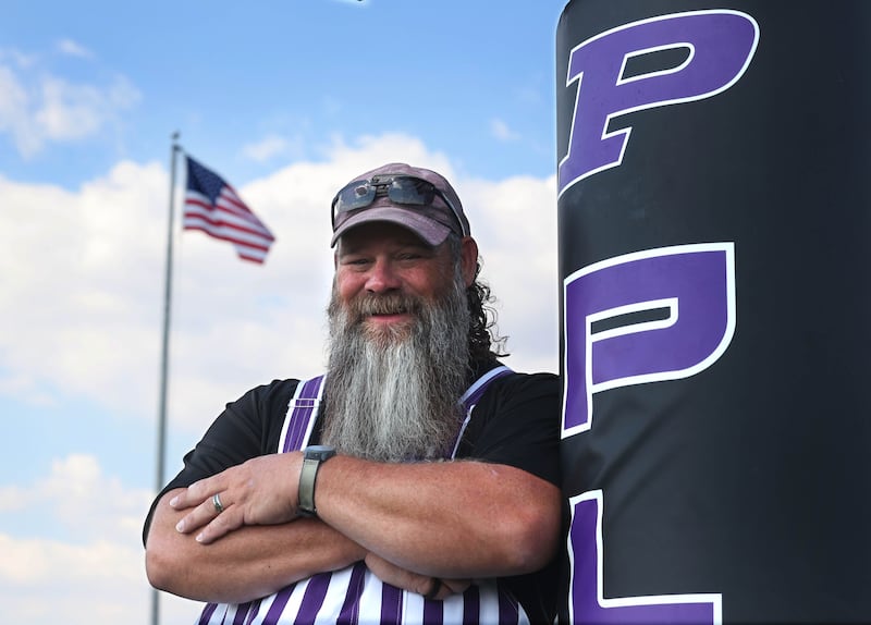 Ken Ridgeway, Plano High School grounds keeper and U.S. Navy veteran, on the football field he takes care of at the school.