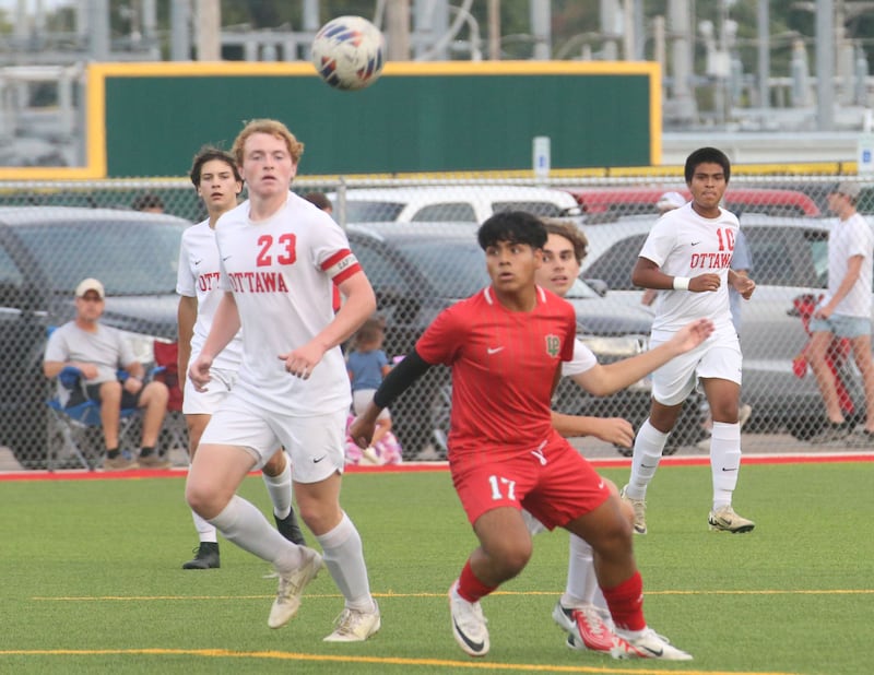 Ottawa's Evan Snook and L-P's Alex Rax wait fot the ball to drop in front of them on Wednesday, Sept. 18, 2024 at the L-P Athletic Complex in La Salle.
