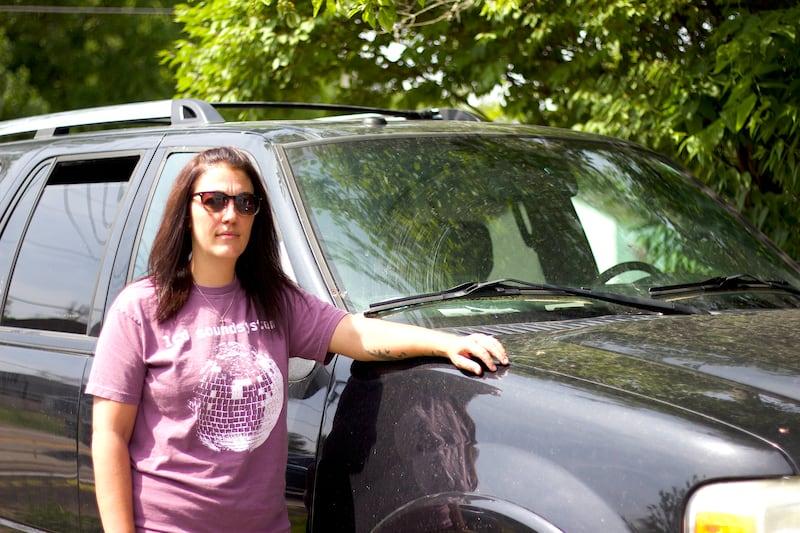 Danielle Duhoski, of New Lenox, standing next to her 2012 Ford Expedition on June 15, 2025, outside her residence.