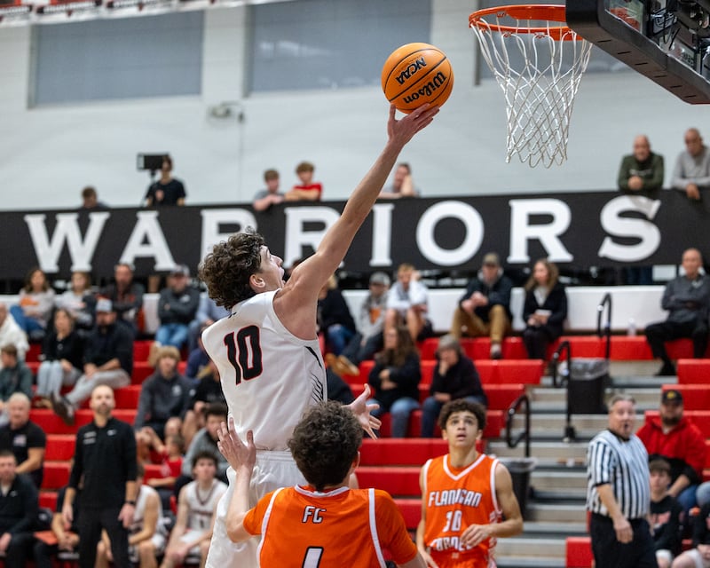 Woodland's Jaron Follmer (10) rolls in a layup against Flanagan-Cornell on Wednesday, Nov. 26, 2025, during the Route 17 Classic at Woodland School in rural Streator.