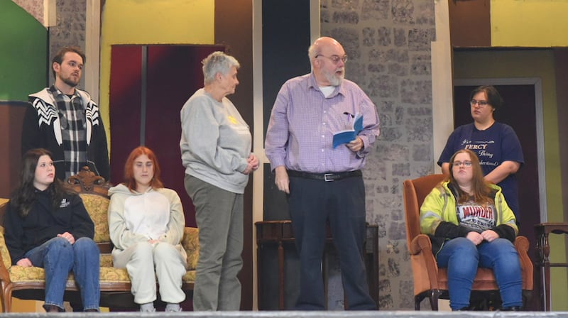 Inspector Cradock reminds everyone of the seriousness of the situation. (left to right) Bailey Kibodeaux as Julia, Josh Hershberger as Edmund, Rhylee Hinkle as Phillipa, Mary Jo Frederick as Miss Marple, Jeff Davidson as Inspector Craddock, Katelyn Kruger as Miss Bunner, and Morgan Ayling as Sergeant Mellors.