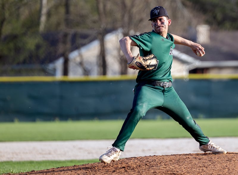 Rock Falls’ Austin Castaneda winds up for a pitch against Newman Wednesday, April 23, 2025.