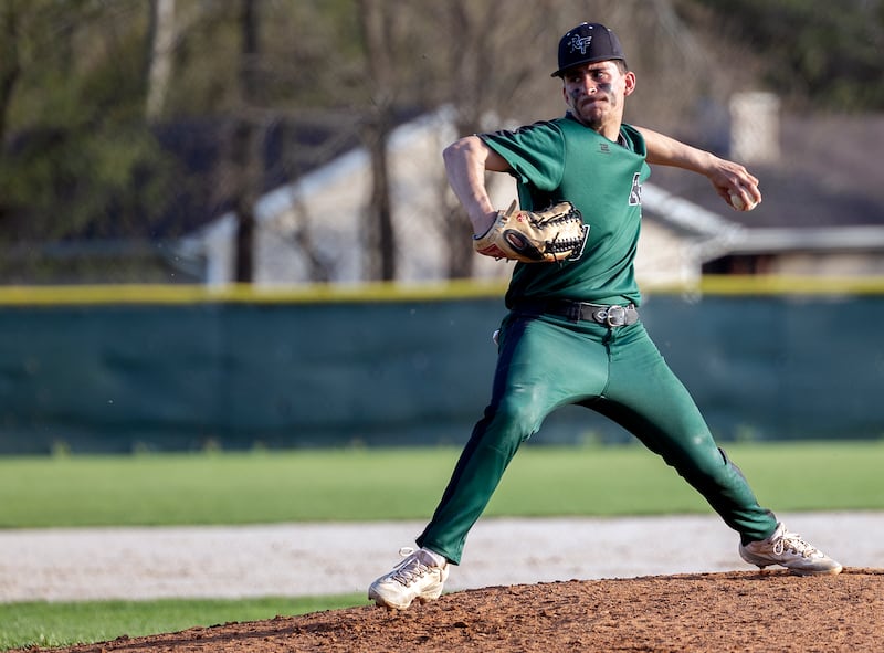 Rock Falls’ Austin Castaneda winds up for a pitch against Newman Wednesday, April 23, 2025.