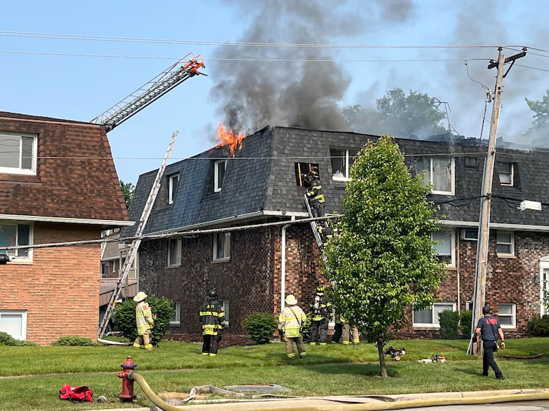 Firefighters battle a fire at an apartment building on Essington Road In Joliet on Tuesday, June 10, 2025.