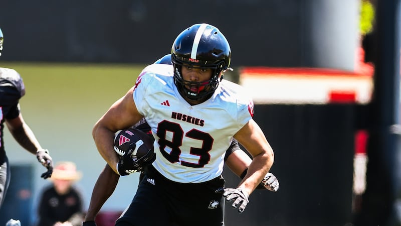 Suit and tie, ready to play: NIU tight end, Niles West grad Jason Fowler, doing more than dressing the part