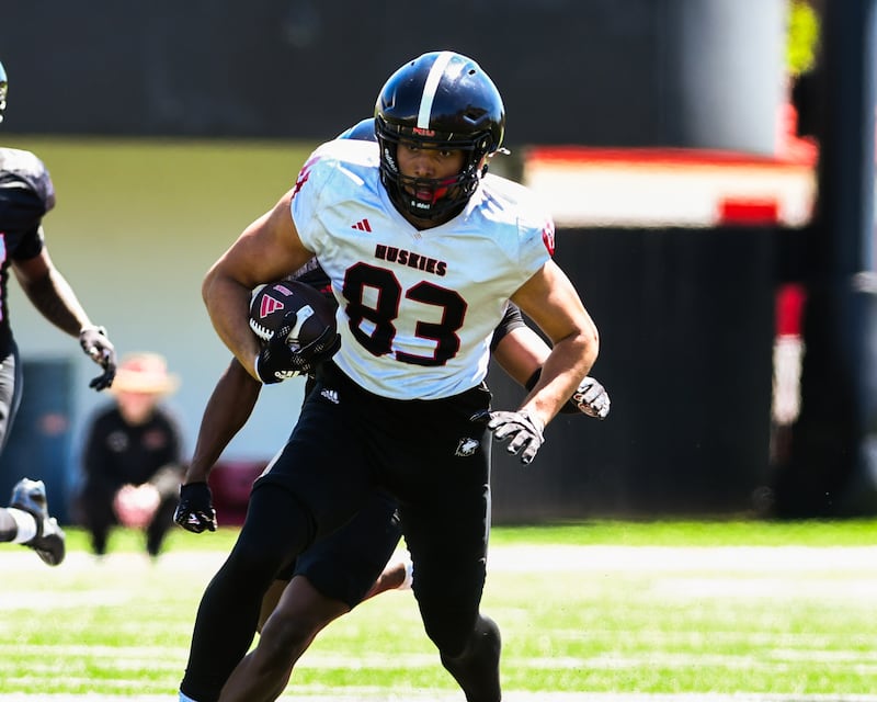 Northern Illinois University's tight end Jason Fowler (83) gains some yards before being brought down during the spring football scrimmage game on Saturday, April 25, 2026.