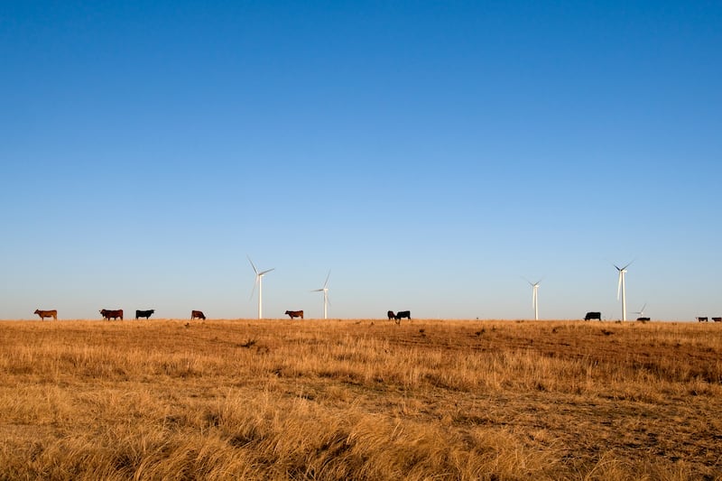 Windmills tower over rural land at a wind farm by Pattern Energy, owner of Heritage Prairie Renewable, at its Post Rock project in Kansas. The company has two projects slated for Kankakee and Livingston Counties - Heritage Prairie Wind and Heritage Prairie Solar.