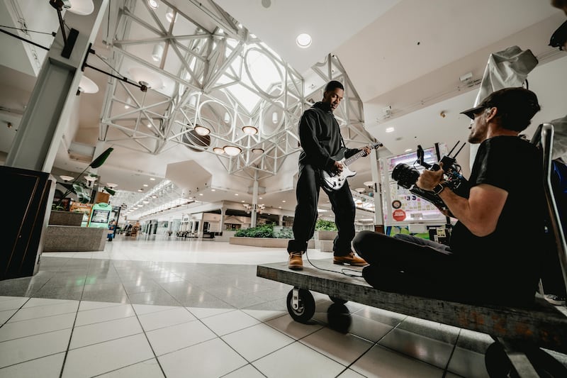 The Boston-based rock band Fleshwater performs "Last Escape" during the recording of a music video in Northfield Square mall.