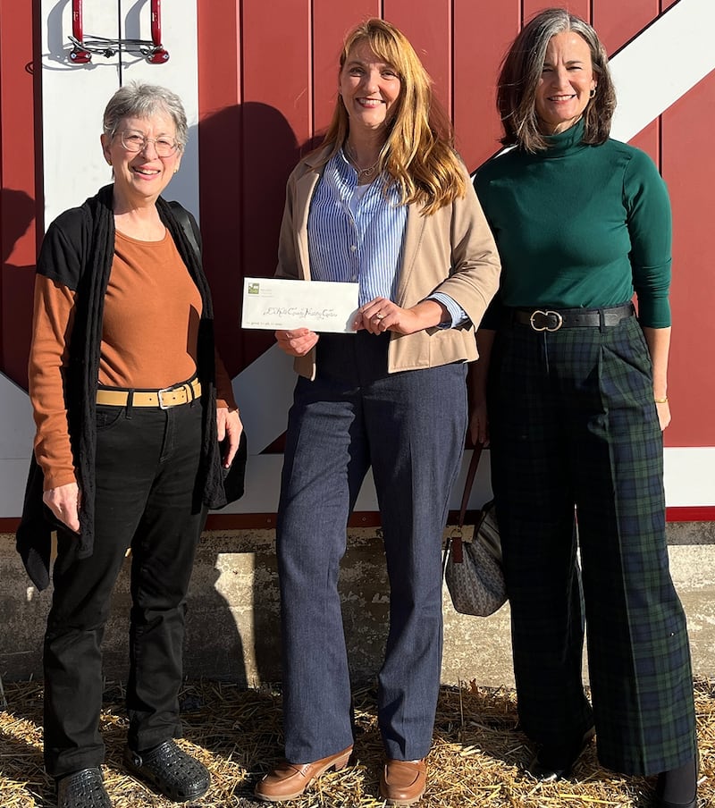 DeKalb County Community Foundation representatives Deborah Booth and Sara Nickels presenting a Farny R. Wurlitzer Foundation Fund grant to DeKalb County History Center executive director Michelle Donahoe