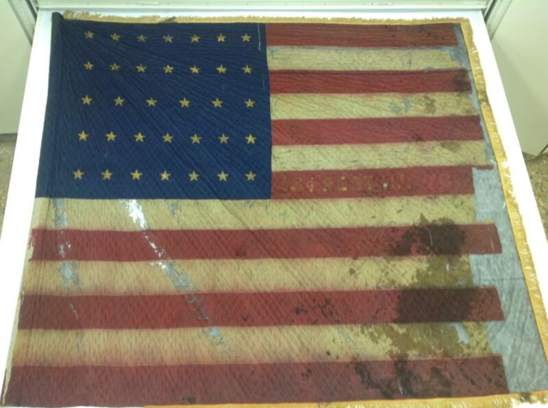 The lower outside corner of the flag of the 53rd Illinois Infantry shows the blood of Civil War Sgt. George Poundstone, of Grand Ridge.
