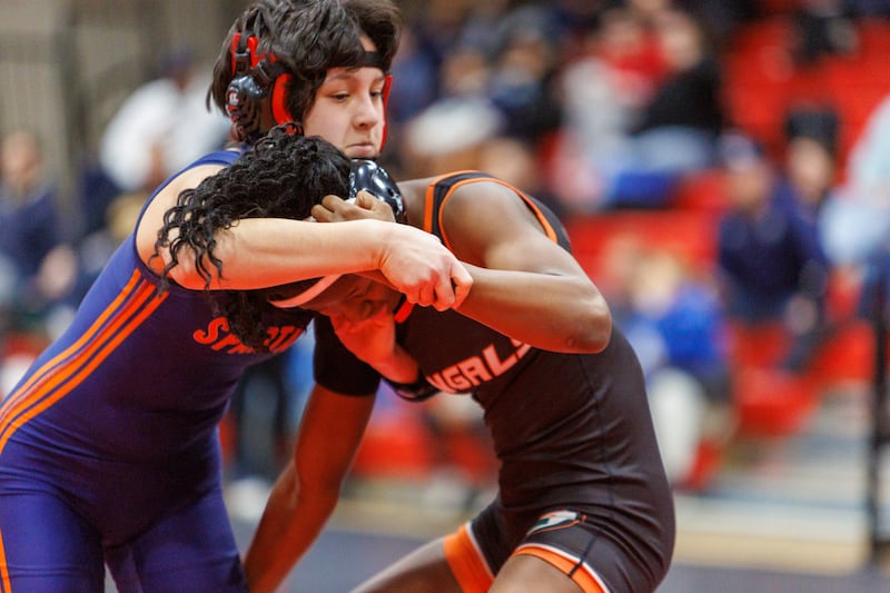 Romeoville's Daniela Santander and Angelina Nettey compete in the championship 110 lb class at the East Aurora Wrestling Regional on Saturday, Feb.7,2026 in Aurora.