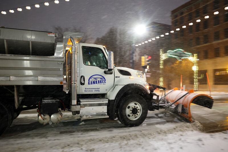 A city of Kankakee snow plow clears accumulated snow on South Schuyler Avenue on Saturday, Nov. 29, evening as flurries fell most of the day.