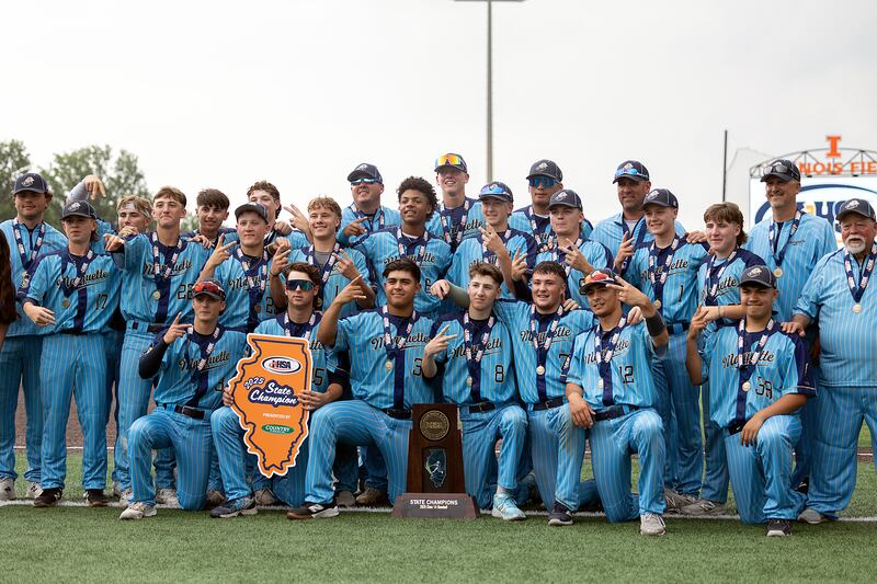 The Ottawa Marquette Crusaders celebrate their second consecutive first place state trophy Saturday, June 7, 2025, during the Class 1A state baseball final at Illinois Field in Champaign.