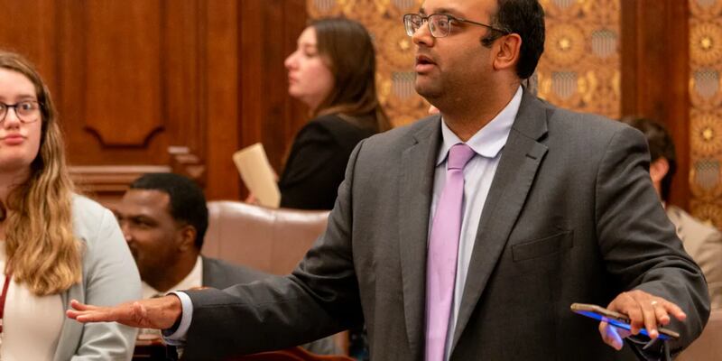 Sen. Ram Villivalam, D-Chicago, signals to a parliamentary officer during the vote on his transit reform package just before midnight on May 31.
