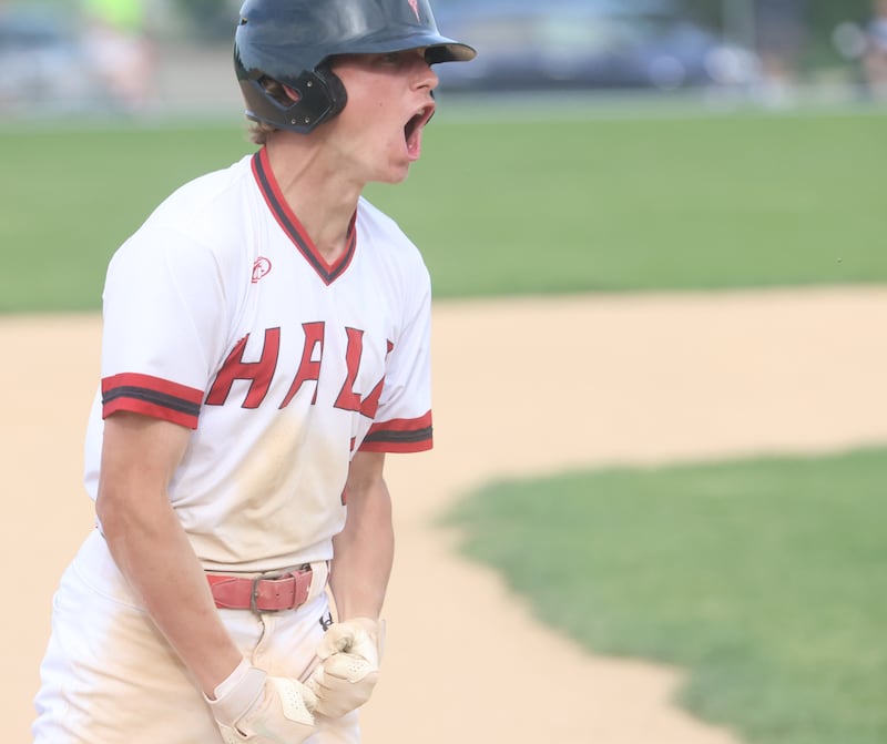 Hall's Hunter Edgcomb reacts after sliding safe into third base during the Class 2A Regional semifinal game on Thursday, May 28, 2026 at Princeton High School.