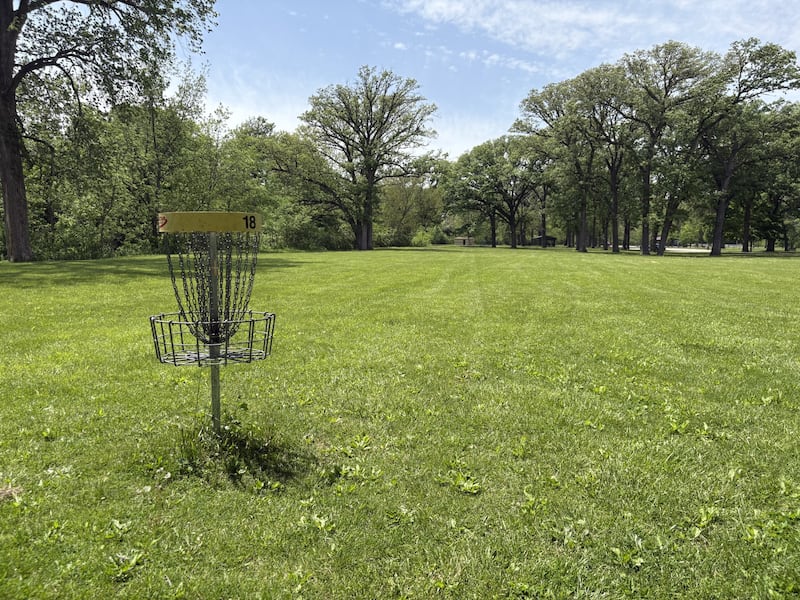 The basket at Hole 18 at Marilla Park in Streator stands as the finishing point of one of the region’s most popular disc golf courses. Organizers are working to expand the course in phases, beginning with three temporary holes planned ahead of a May 25 tournament.