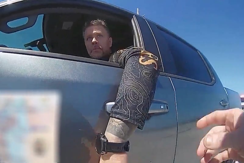 In this screengrab made from body camera footage provided by the Monroe County, Fla., Sheriff's Office, off-duty U.S. Immigration and Customs Enforcement agent Scott Deiseroth argues with a deputy who pulled him over for drunk driving with his children in the car in August 2025. (Monroe County Sheriff's Office via AP)