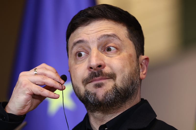 Ukraine's President Volodymyr Zelenskyy reacts during a press conference with German Chancellor Friedrich Merz at the Chancellery in Berlin, Germany, Monday, Dec. 15, 2025. (AP Photo/Maryam Majd)