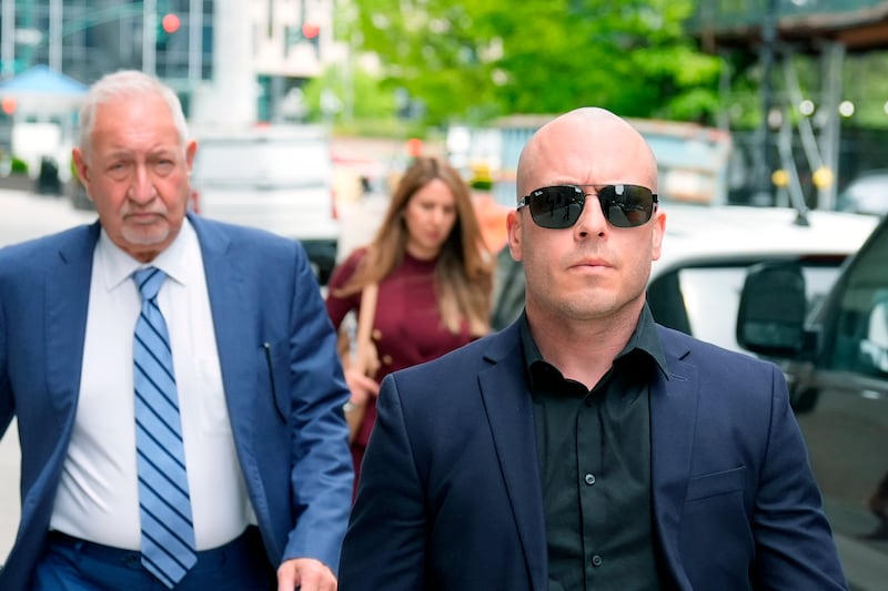 Gannon Ken Van Dyke, right, walks with his attorneys near a federal court building in New York on Tuesday, April 28, 2026. (AP Photo/Seth Wenig)