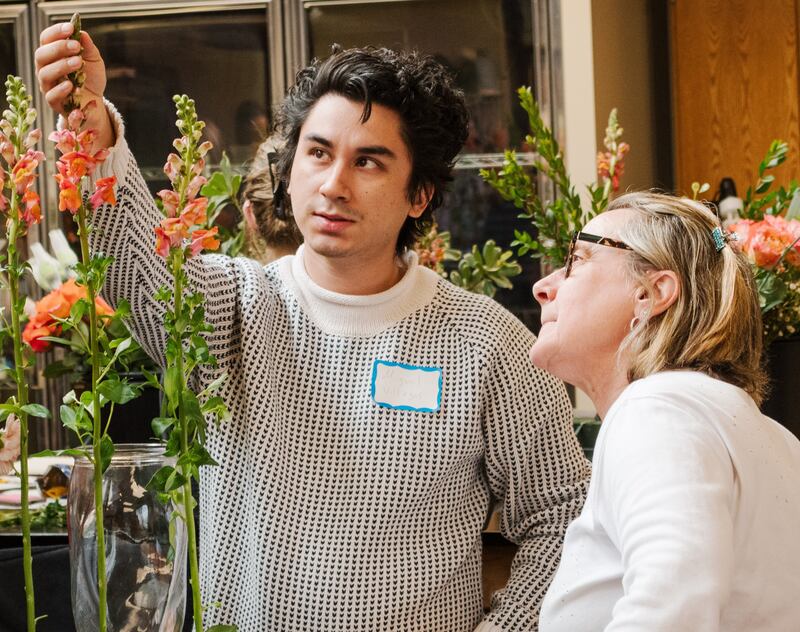 Kishwaukee College students learning Julie Poeltler's sympathy floral design