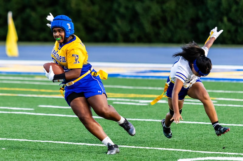 Joliet Central's Georgiana Majerus runs the ball during a varsity flag football home game against Bloom on Sept. 11, 2025.
