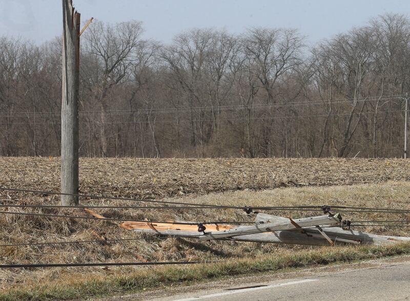 A snapped power pole lays in the ditch along Illinois Route 71near the intersection of Holmes Road on Saturday, March 15, 2025 near Hennepin. High winds from Friday's storm caused some power outages across the Illinios Valley.