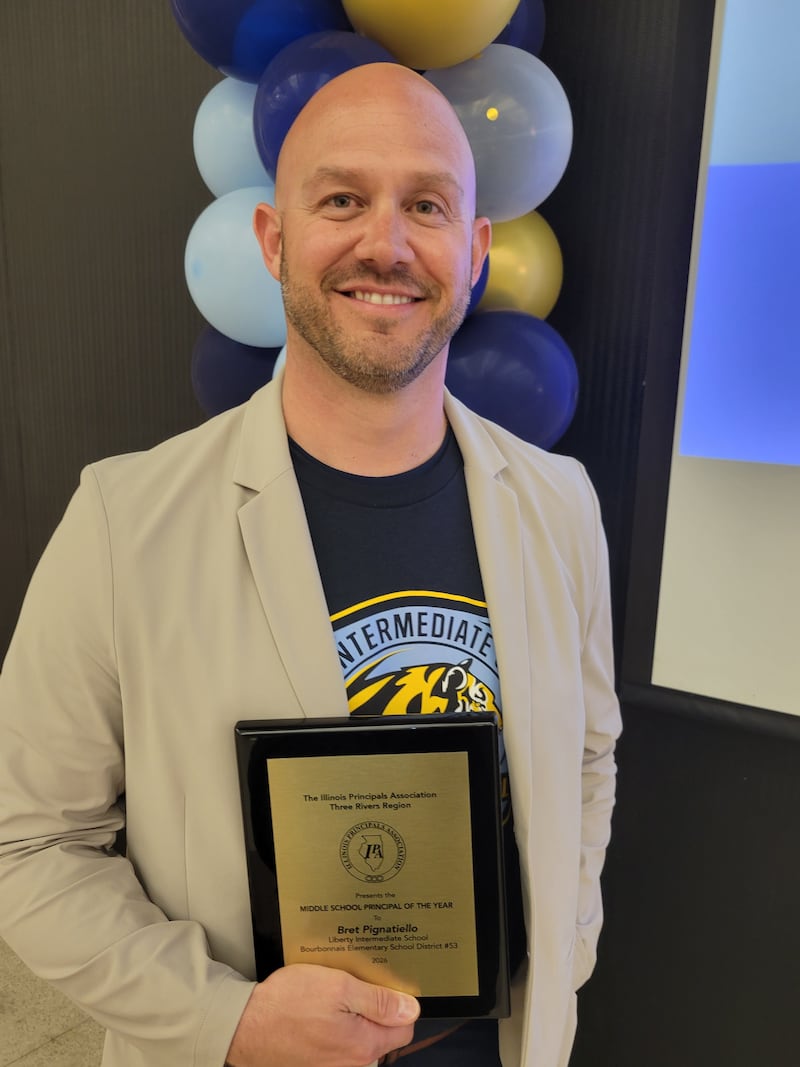Liberty Intermediate School Principal Bret Pignatiello was presented with a plaque for Middle School Principal of the Year for the Three Rivers Region by the Illinois Principals Association on April 28, 2026.