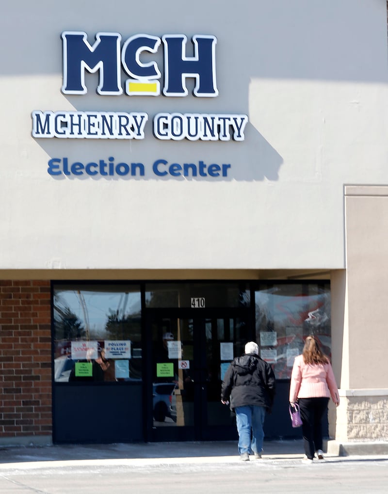Voters walk into the McHenry County Election Center on Tuesday, March, 17, 2026, to cast their ballots in the Illinois primary. The Election Center serves as a universal polling place, accessible to all McHenry County voters.