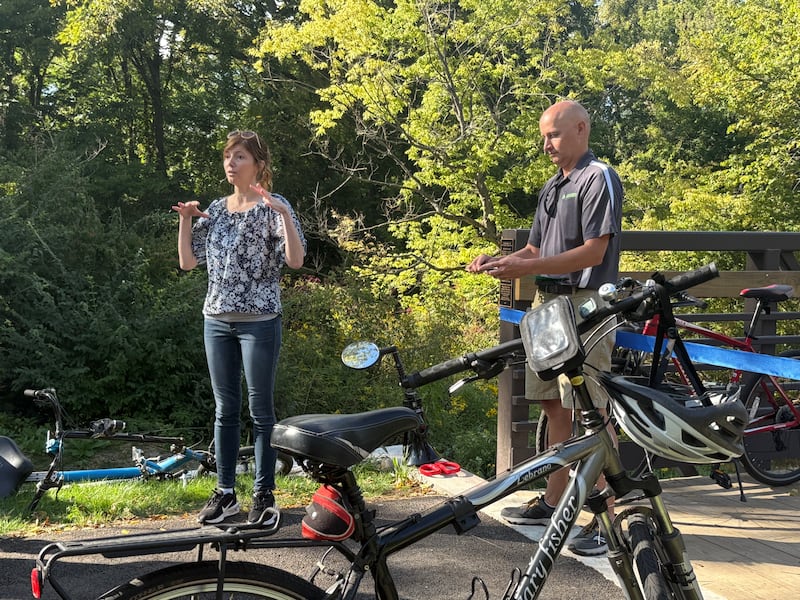 Sue Stillwell (left), president of the Village of Sugar Grove, speaks during a ribbon cutting for the Bridge at Belle Vue Park on Sept. 5, 2025, in Sugar Grove.