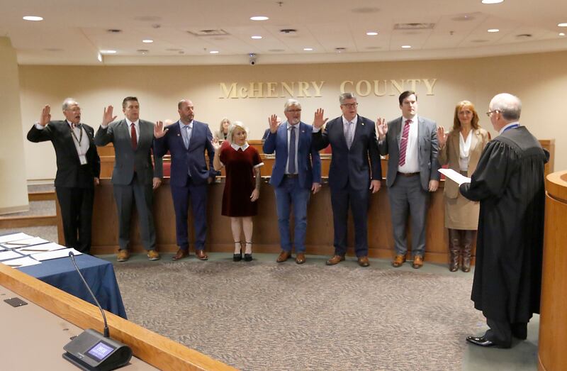 McHenry County Chief Judge Michael Feetterer administers the oath of officer to the recently elected members of the McHenry County Board on Monday, Dec. 2, 2024, at the McHenry County Administration Building in Woodstock. Sworn in from left to right: Carl Kamienski, R- Johnsburg, Mike "Shorty" Shorten, R-Crystal Lake, Paul Thomas, R-Wonder Lake, Deena Krieger, R-Island Lake, Pat Sullivan, R- Algonquin, John Collins, R-Crystal Lake, Eric Hendricks, R-Lake in the Hills and Tracie Von Bergen, R-Hebron. Also sworn in were County Board Chair Mike Buehler, R-Crystal Lake and Board member Jim Kearns, R-Huntley.