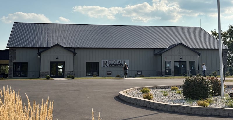 People walk into the new RedTail Golf Club clubhouse on Aug. 14, 2025 in Lakewood.
