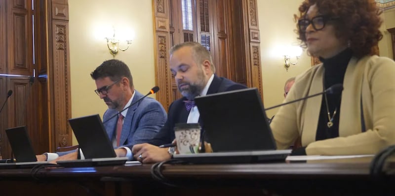 Rep. Camille Lilly, right, testifies before a House committee for passage of a bill calling for an audit of the federal 340B drug pricing program in Illinois. Also testifying were Peter Fotos, left, of Pharmaceutical Research and Manufacturers of America, and John Conrad of the Illinois Biotechnology Industry Organization.