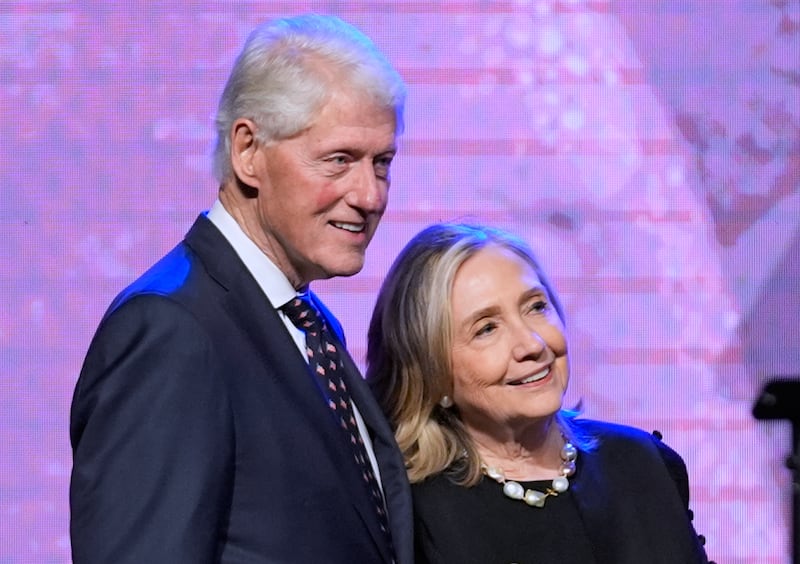 FILE - Former President Bill Clinton, left, and former Secretary of State Hillary Clinton listen as Vice President Kamala Harris delivers a eulogy for U.S. Rep. Sheila Jackson Lee, Aug. 1, 2024, in Houston. (AP Photo/LM Otero, File)