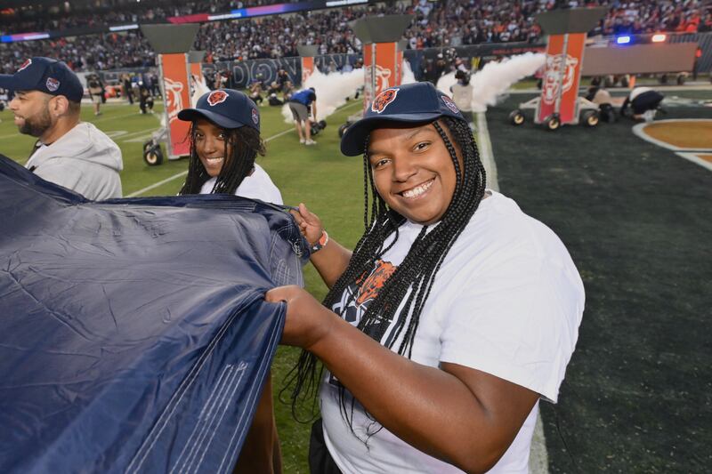 Candice Porter holds the Bear Down flag at the Bears vs. Vikings game on Sept. 8.