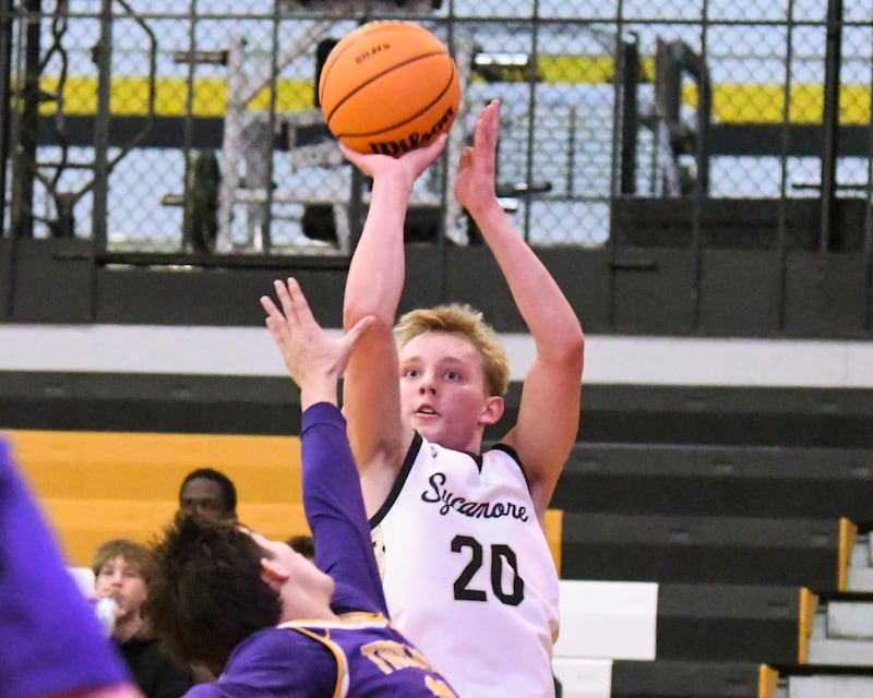 Sycamore's Isaiah Feuerbach (20) takes a shot while being defended by Mendota's Oliver Munoz (13) during the game on Wednesday Dec. 17, 2025, held at Sycamore High School.