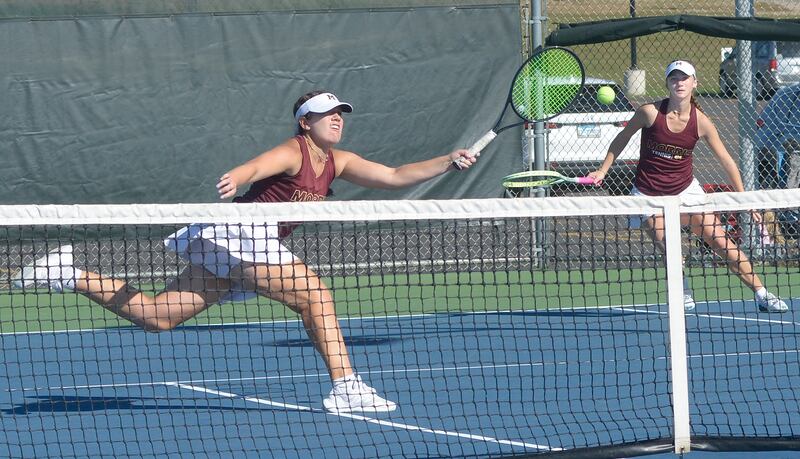 The Morris doubles team of senior Julia Borgstrom and junior Skyler Saelens work for a point during their doubles finals match against Pontiac of Saturday's Class 1A Ottawa Sectional at the Henderson-Guenther Tennis Facility.