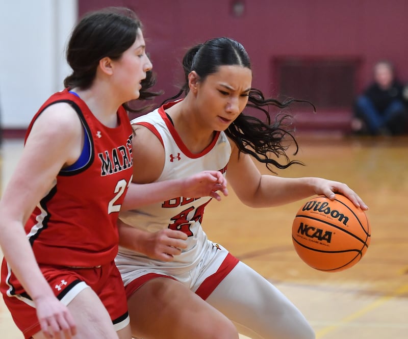 Benet’s Emma Briggs drives to the basket as Marist’s Lily Porter defends during the Montini Christmas Tournament championship game on December 27, 2025 at Montini Catholic High School in Lombard.