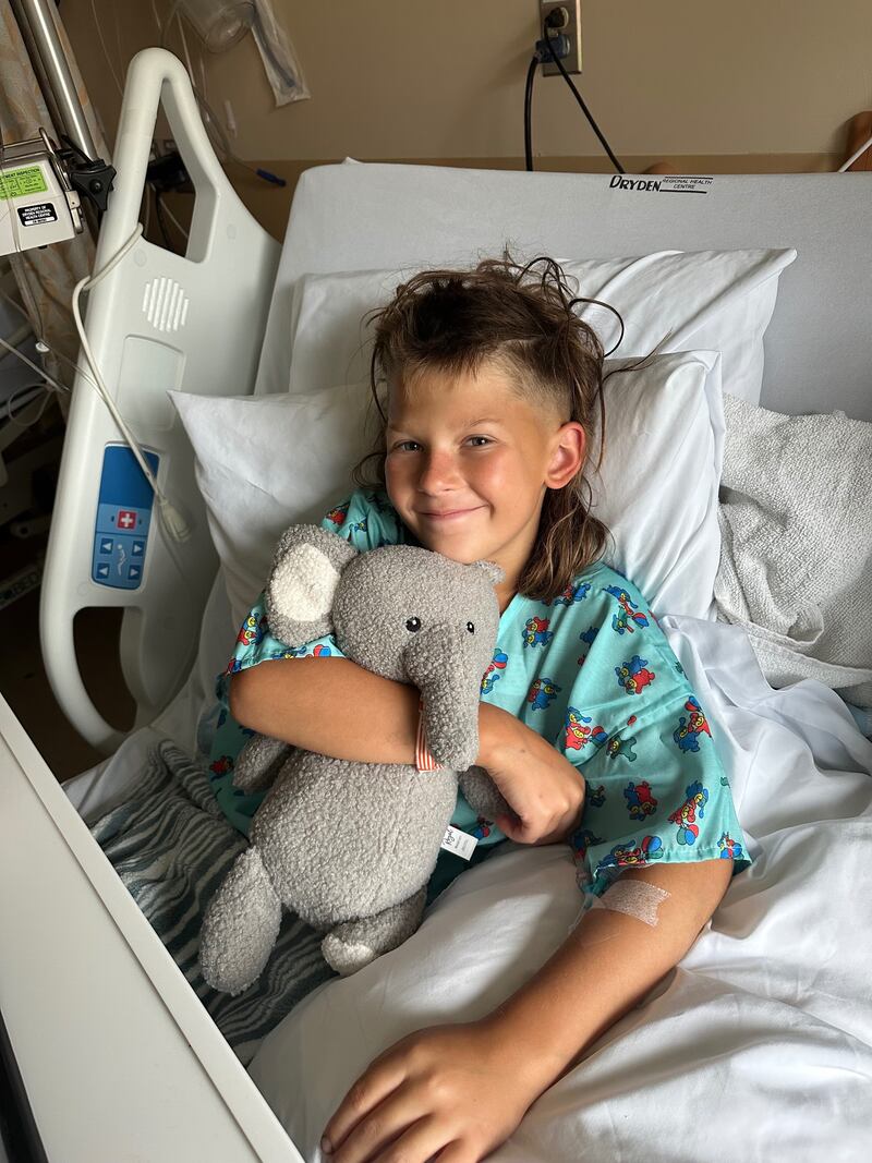 Brayden Quiros, 10, of Huntley, was left with lacerations from a propellor after their boat hit an unmarked underwater boulder, flipping him out and into the water while in a fishing trip to Canada.