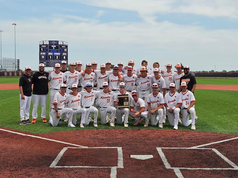 The Minooka baseball team celebrates their regional championship win over Plainfield Central on Saturday.