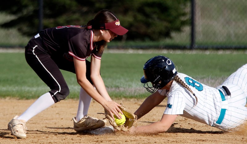Richmond-Burton's Jocelyn Hird tries total Woodstock North's Kylie Stevens as she steal second base during a Kishwaukee River Conference softball game on Thursday, April 16, 2026, at Woodstock North High School.