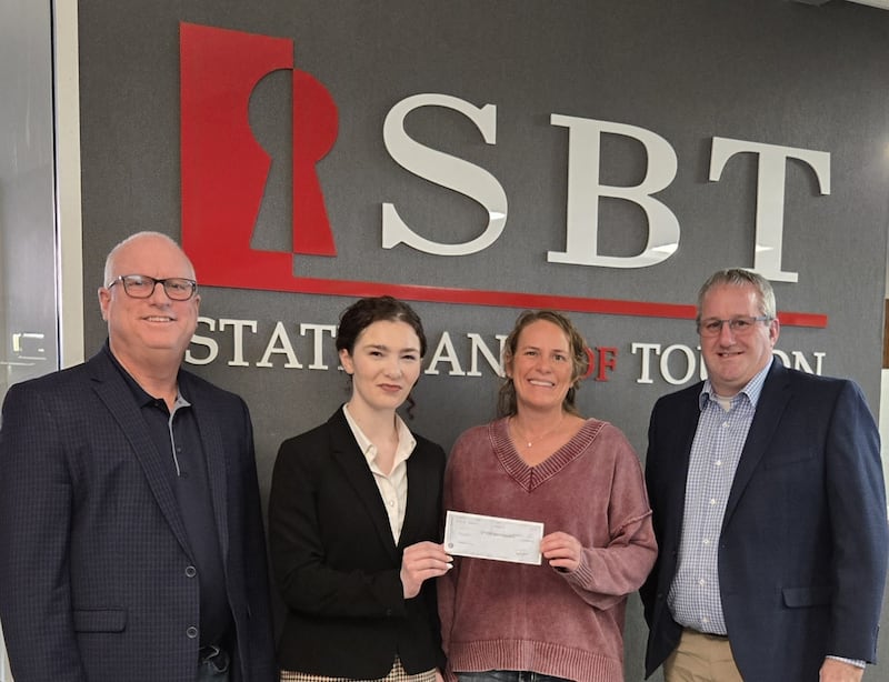 Pictured are Doug Parrott, President and CEO of SBT, Chloe Lund, Chief Operating Officer for Freedom House, Jennifer Tanner Beaver, Freedom House Board Member and Doug Blunier, Executive Vice President and Chief Lending Officer, presenting Tanner Beaver with a check for $50,000 towards the renovation of the Kewanee domestic violence shelter