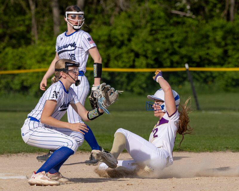 RayElle Brennan slides into second base for an attempted stolen base against Newark High School during the game earlier this season at Newark High School.