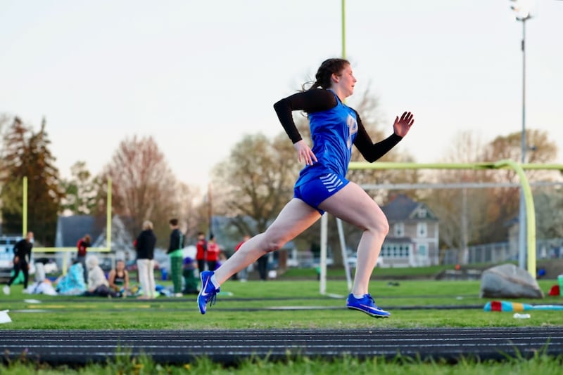Princeton's Camryn Driscoll stretches it out in Monday's Ferris Invite at Princeton. She won the 100, 200 and 400.