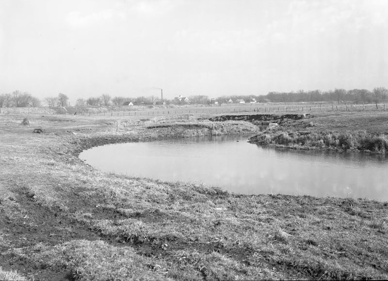 The Kishwaukee River looking northeast toward the railroad tracks and Northern Illinois State Teachers College (now NIU) in DeKalb in 1942.