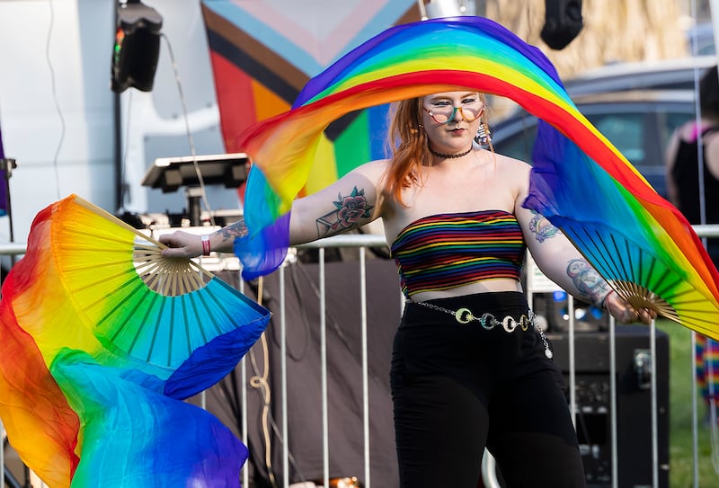 Sydney Brown dances with colorful fans Saturday, June 14, 2025, during Sauk Valley Pride Fest in Dixon.